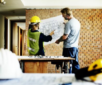 Optimized-construction-team-working-on-a-blueprint-PTWBMYW_1 Optimized-construction-team-working-on-a-blueprint-PTWBMYW_1